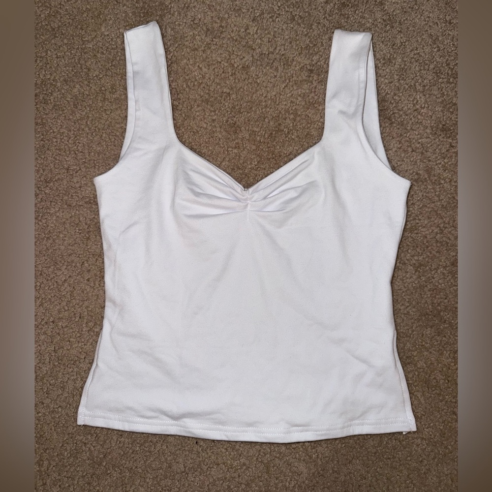 white tank with side splits